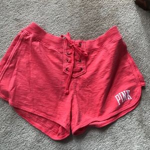NIP VS PINK VARSITY LACEUP SHORTS CORAL SZ SM